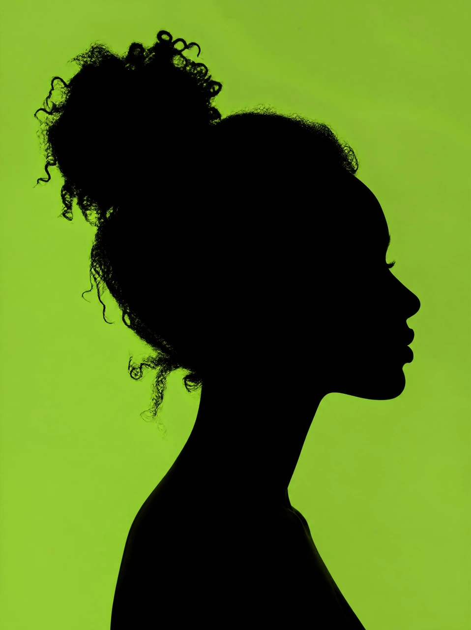 Create a dramatic black side-profile silhouette of a person with curly hair against a vivid green background, ideal for bold portrait posters, editorial visuals, and minimalist campaign imagery.